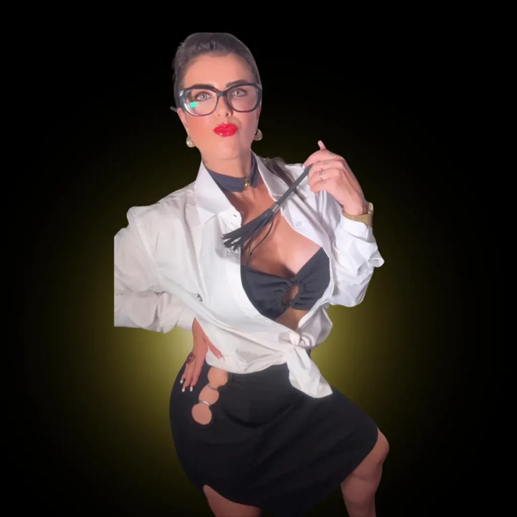 Lorene Patigra com visual de professora sedutora, reforçando sua autoridade em performance e desejo masculino.